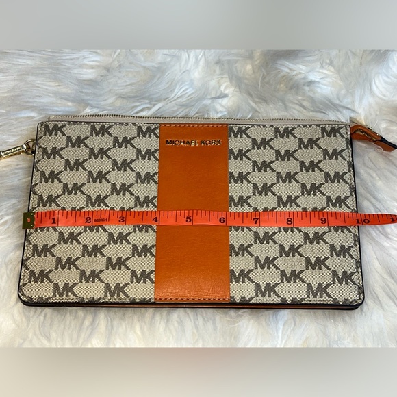 Michael Kors, orange and tan clutch with zipper. In great condition. LIKE NEW!! - Picture 10 of 13